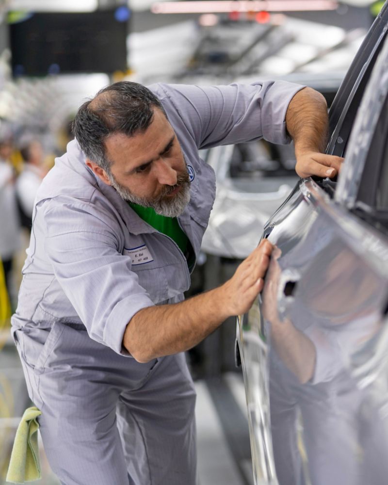 VW employee working at Volkswagen plant Wolfsburg