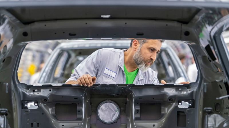 VW employee working at Volkswagen plant Wolfsburg