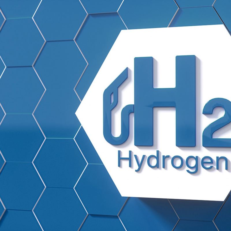 abstraktes sechseckiges Wabengitter mit hervorgehobener Wabe mit Schriftzug Hydrogen und Symbol für Wasserstoff-Tanken