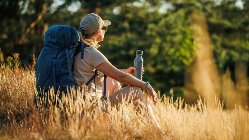 Hiking with a drinks bottle.