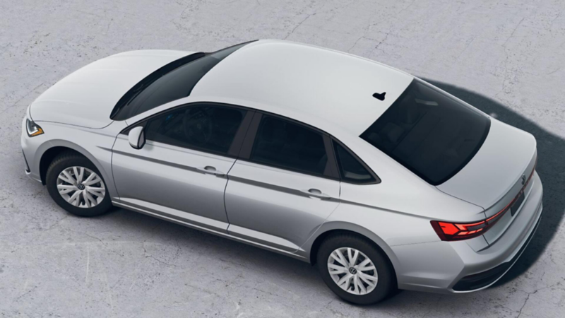 Volkswagen Jetta Trendline. Vista aérea de sedán en color blanco sobre un espacio de concreto.