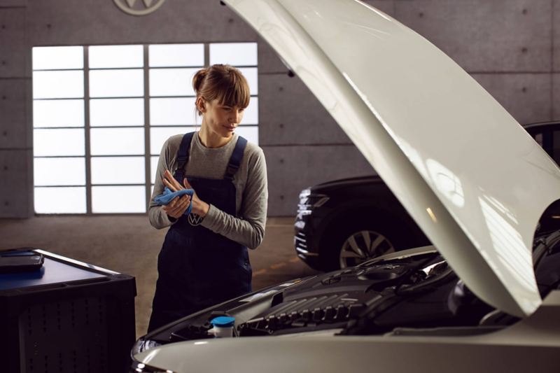 VW certified technician working on a vehicle