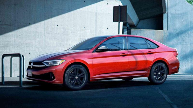Sedán Jetta de Volkswagen, edición 2023, en color rojo con rines negros. 