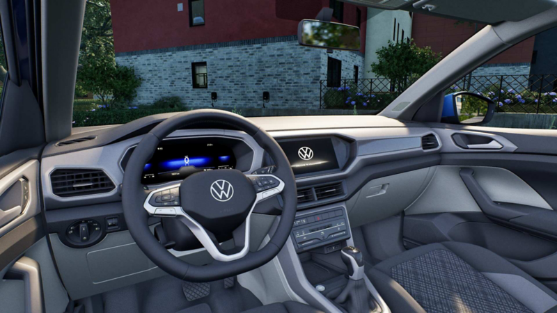 Interior de Taigun 2024, con volante multifunciones y pantallas. 