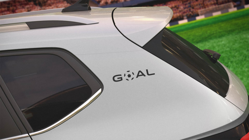 Emblema GOAL en el exterior de Volkswagen Taos 2026 de color blanco.