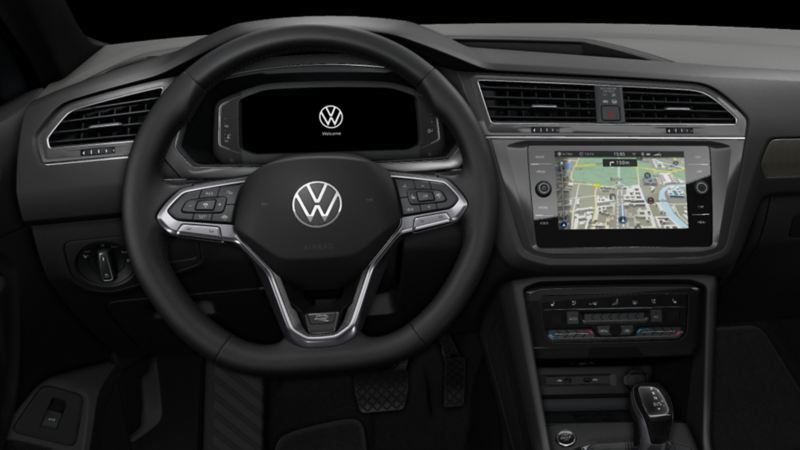 Interior de Volkswagen Tiguan 2024, con pantallas y volante multifunciones.