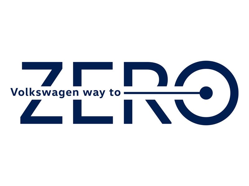 Das Volkswagen Way to Zero Logo auf weißen Hintergrund.
