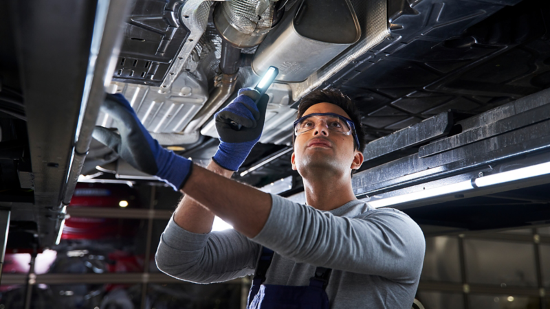 Volkswagen technician working on car