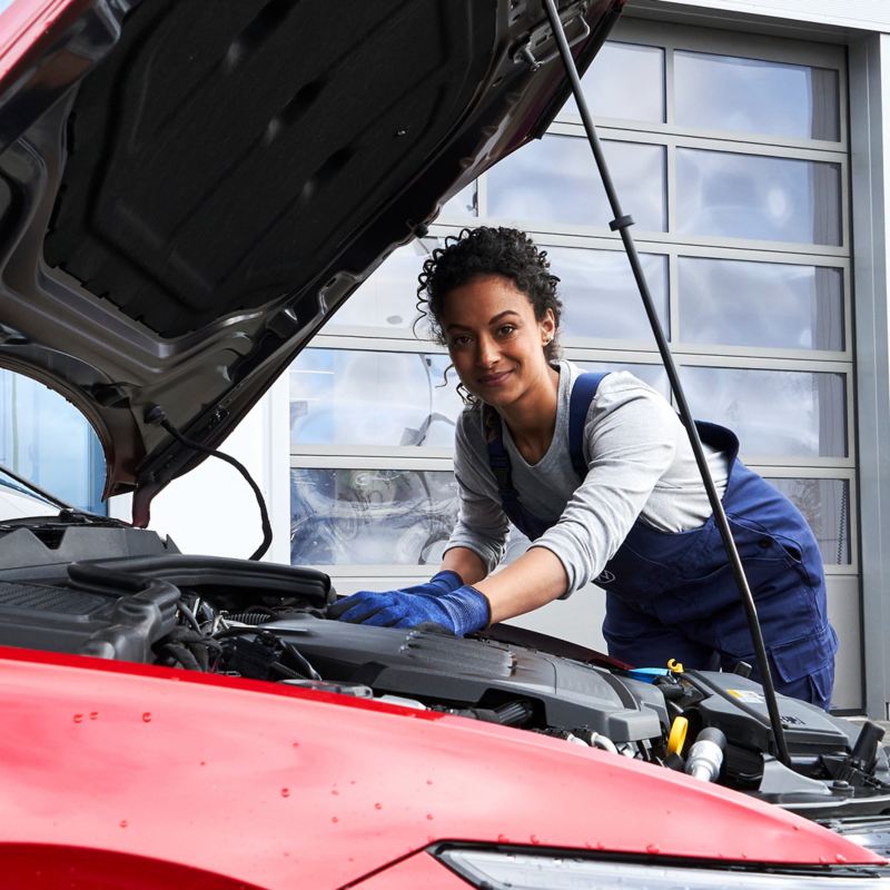 A VW technician working on a VW