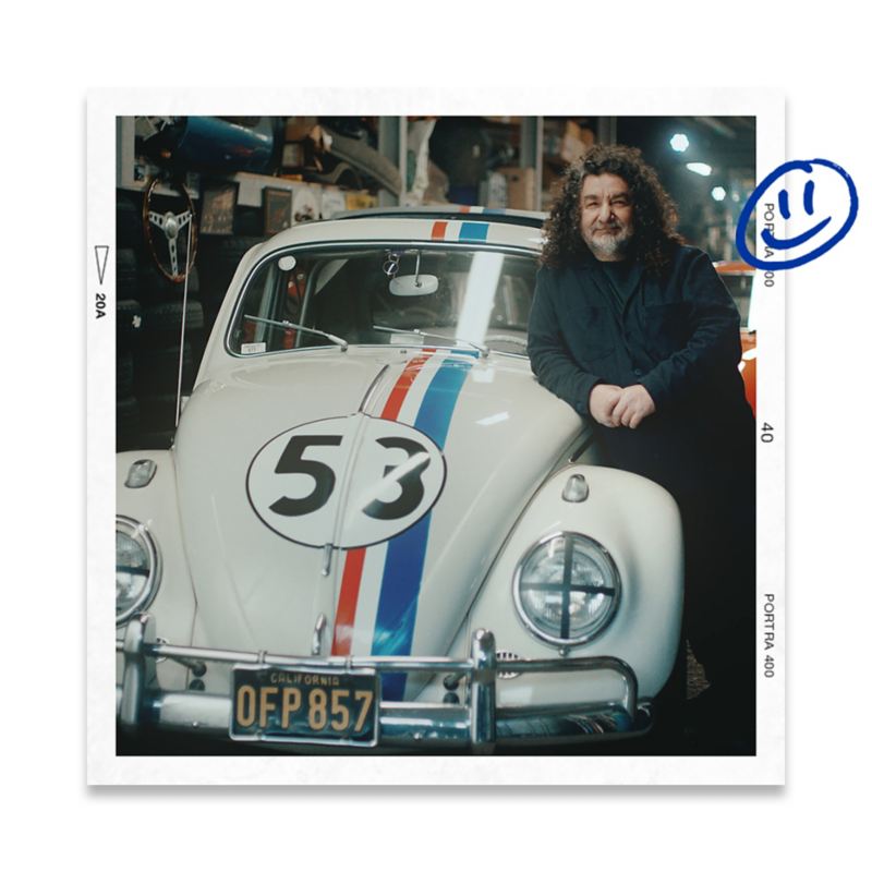Luke leaning on his vintage VW Beetle