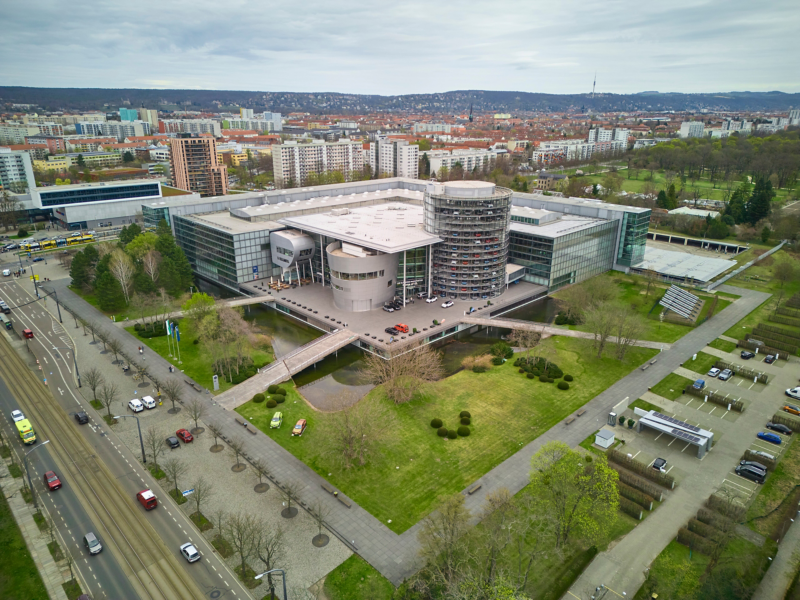 Aerial view of the Transparent Factory with outdoor facilities and pond