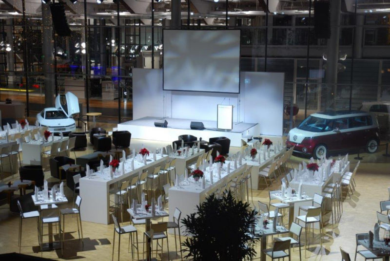 Tables, chairs and decorations in the ID Forum for an event